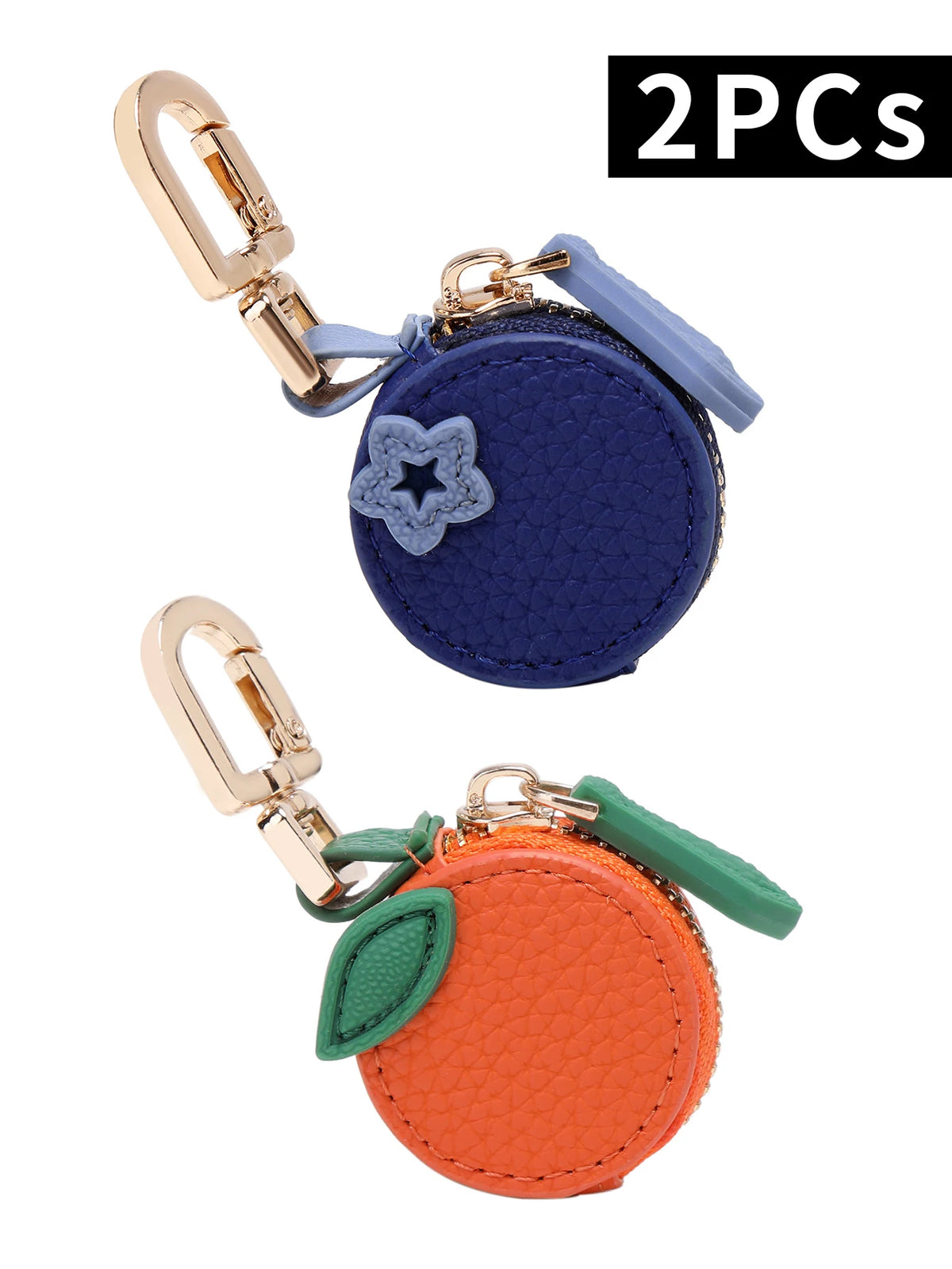 Two coin purse keychains featuring a blue star and an orange cherry fruit shape.