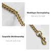 A close-up of a gold-toned metal chain bag strap with exquisite workmanship and a smooth, shiny finish.