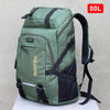A dark green large capacity travel backpack with black accents and a black rain cover.