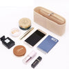 A collection of felt organizers, including a zippered pouch, a round compact, and various cosmetic items.