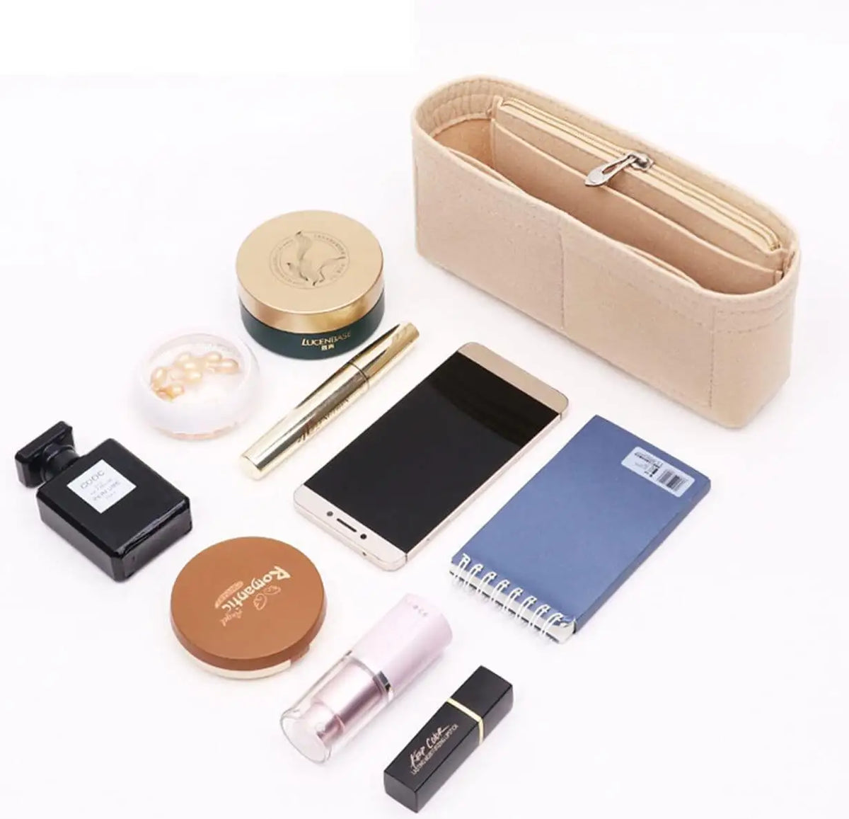 A collection of felt organizers, including a zippered pouch, a round compact, and various cosmetic items.