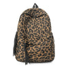 A brown and black leopard print canvas backpack with dark drawstring details.