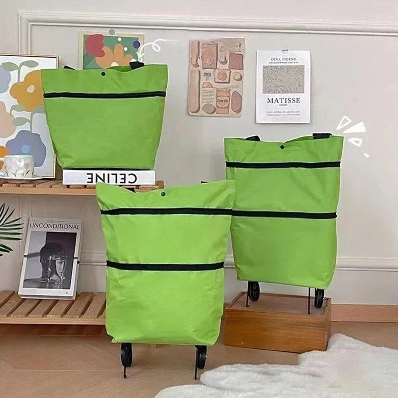 A lime green folding Oxford cloth shopping trolley bag displayed on a wooden shelf with framed art.