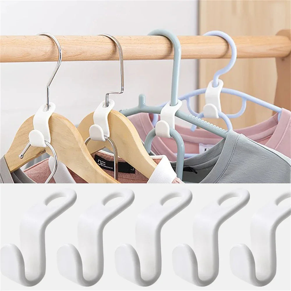 A set of multi-hook wardrobe organizers in light wood and pastel colors hanging on a wooden rod.
