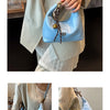 A light blue retro PU leather shoulder bag with a gold chain strap is shown being held by a person.