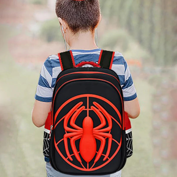 A red and black fashion kids backpack featuring a large spider design on the front.