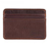 A dark brown genuine leather card holder with stitched edges.