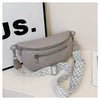 A light gray PU leather multi-pocket crossbody bag with a patterned strap is displayed on a white surface.