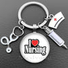 Silver keychain featuring a heart and the word Nursing design with a stethoscope charm