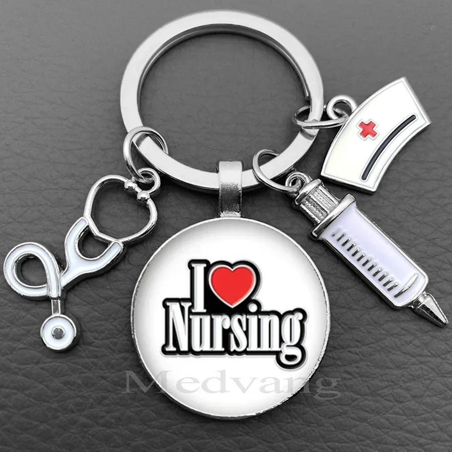 Silver keychain featuring a heart and the word Nursing design with a stethoscope charm