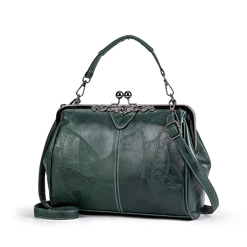 A dark green leather crossbody shoulder bag with a silver-toned chain strap and decorative metal hardware.
