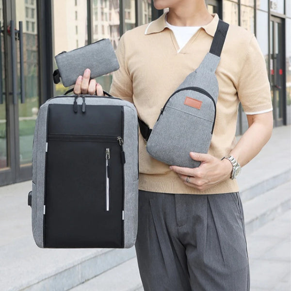 A man wearing a beige shirt and gray pants is carrying a black backpack and a matching wallet.