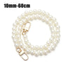 A strand of white pearls used as a strap for a handbag or purse.