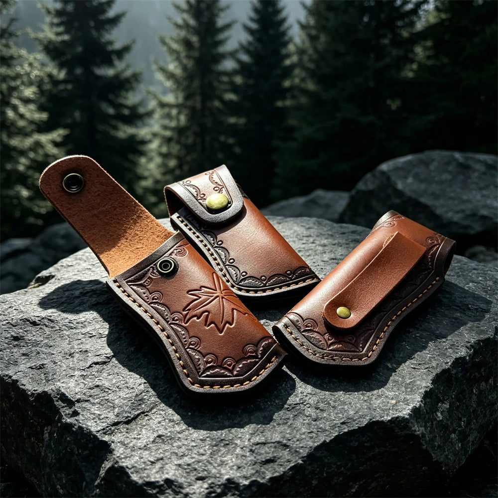 A brown leather knife sheath with a belt loop is resting on a dark gray rock.