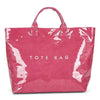 A vibrant pink transparent waterproof PVC tote bag with a handle.