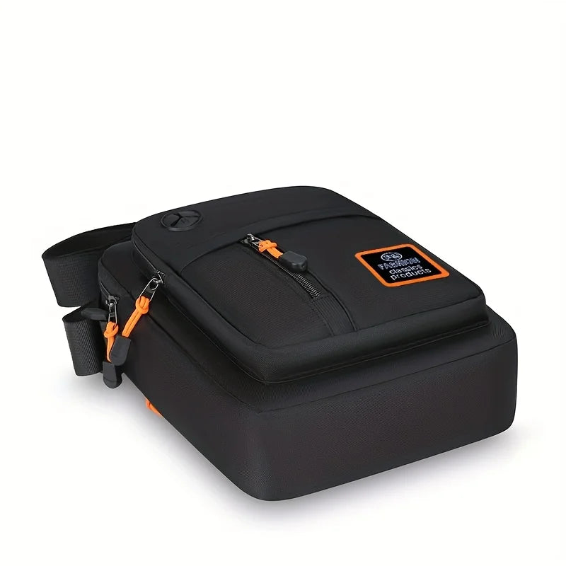 Black men's crossbody sling bag with an orange strap and a headphone port.