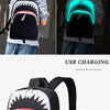 حقيبة ظهر سوداء بتصميم نيون أخضر، تُعرض في صور نهار وليلة مع كابل شحن USB مُرفق.