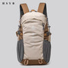 A beige and brown durable 80L waterproof hiking backpack shown from the back.