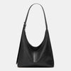 A black women's soft PU leather retro tote bag with a zipper closure.