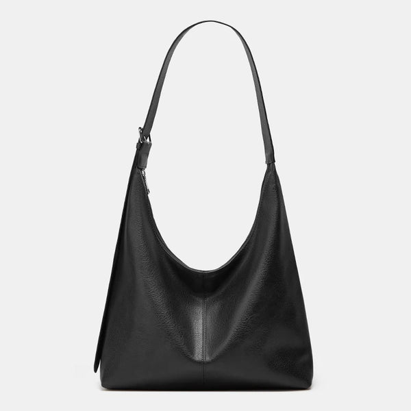 A black women's soft PU leather retro tote bag with a zipper closure.