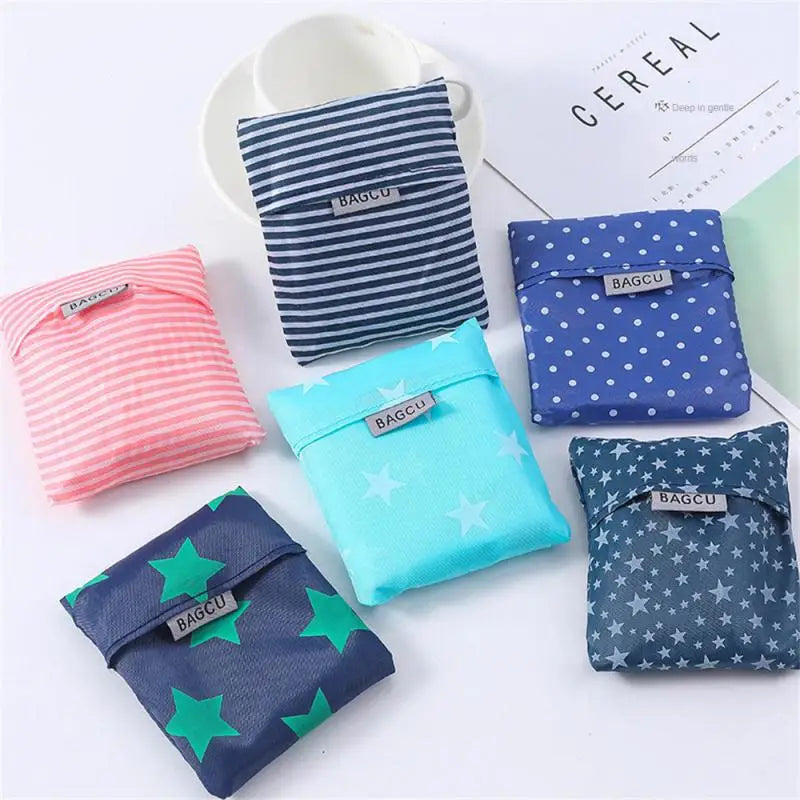 A collection of colorful fabric bags with the BAGCU logo displayed on a white background.