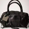 Black vintage PU leather crossbody tote bag with adjustable strap shown from the front.