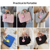 Various views of a pink and gray quilted laptop sleeve or handbag for notebooks.