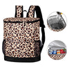 A leopard print cooler backpack with a black strap and an attached clear storage bag.