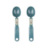 A pair of teal digital kitchen scales with round weighing bowls and light gray measurement displays.