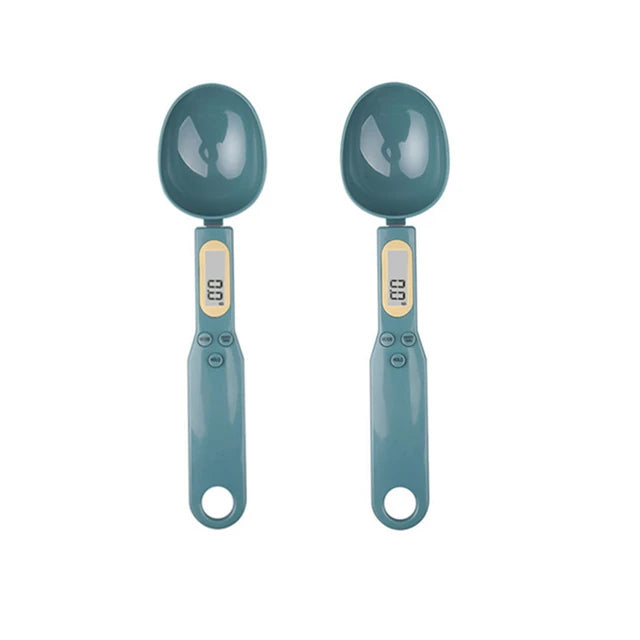 A pair of teal digital kitchen scales with round weighing bowls and light gray measurement displays.