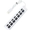 A white 7-port USB splitter hub with individual on/off switches and a detachable cable.