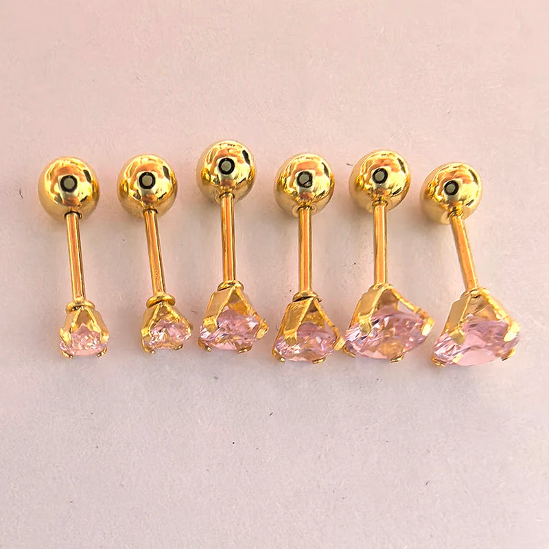 A set of gold-toned ear stud earrings featuring pink gemstone accents.