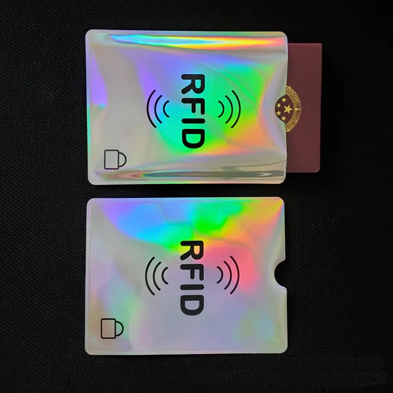 Two clear plastic anti-scan cards with an RFID symbol and the word RFID printed on them.