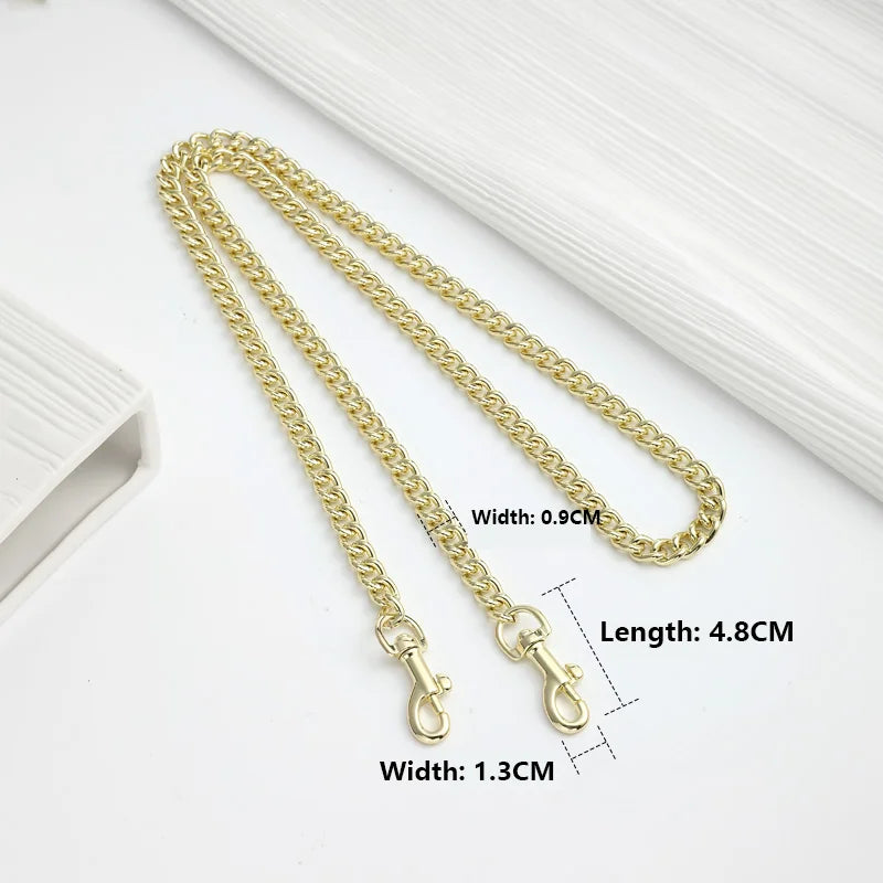 Gold-colored metal chain strap for handbags and crossbody bags shown on a white background.