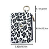 Schwarze und graue Leopardenmuster-PU-Leder-Karteinholder mit goldfarbener Schlüsselring.