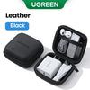 Estuche de cuero negro para AirPods y accesorios con inserto de malla.