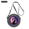 A round crossbody bag featuring a purple and gold celestial design with a silhouette of a black cat.