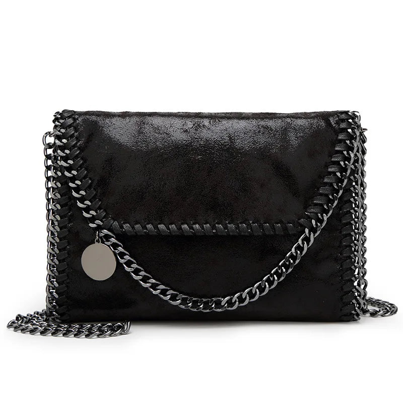 Black vintage flap crossbody bag with a silver chain strap