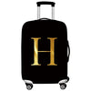 Black rolling suitcase with a gold letter H printed on the side.