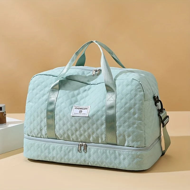 A light mint green durable nylon travel duffle bag with light gray straps and silver hardware.
