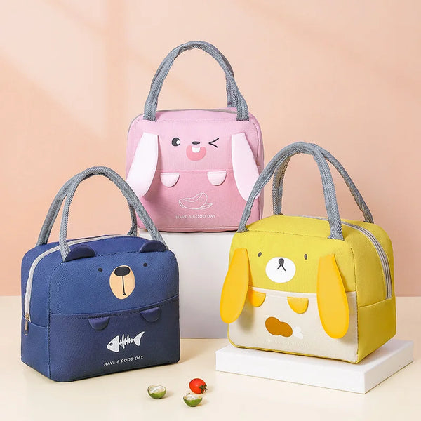 A set of three insulated thermal picnic lunch bags in pink, blue, and yellow for kids