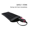 Black heat-resistant silicone mat used for storing hot styling tools.