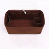A brown felt purse organizer insert with a zipper closure and internal compartments.