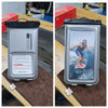 A silver waterproof phone case with a black strap is shown next to a person surfing on the ocean.