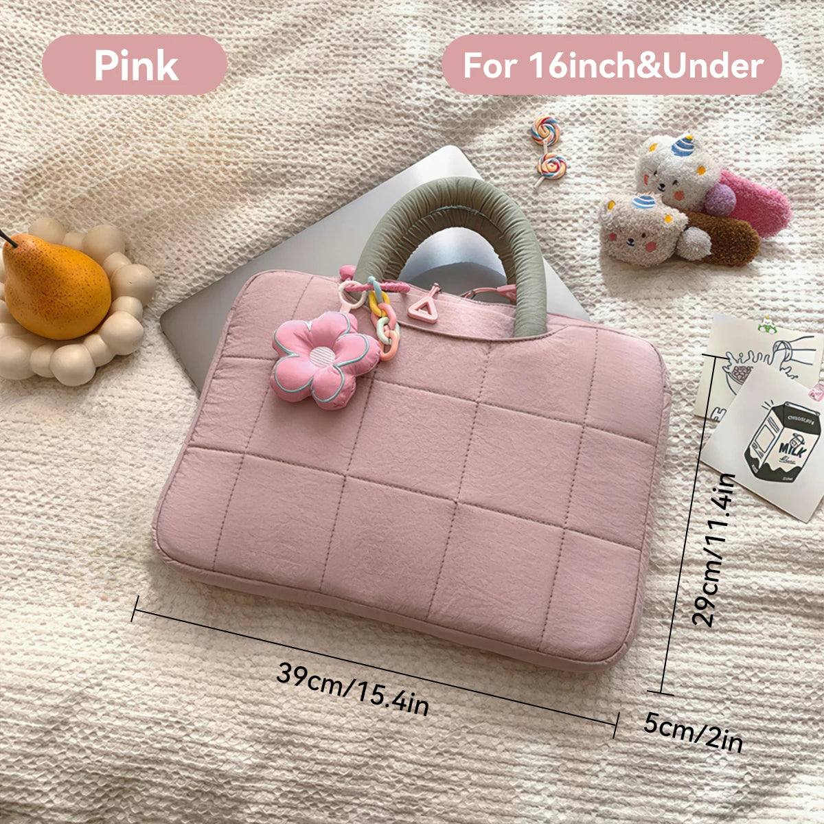 Pink quilted laptop sleeve for 14-16 inch notebooks with a leather strap and cute accessories