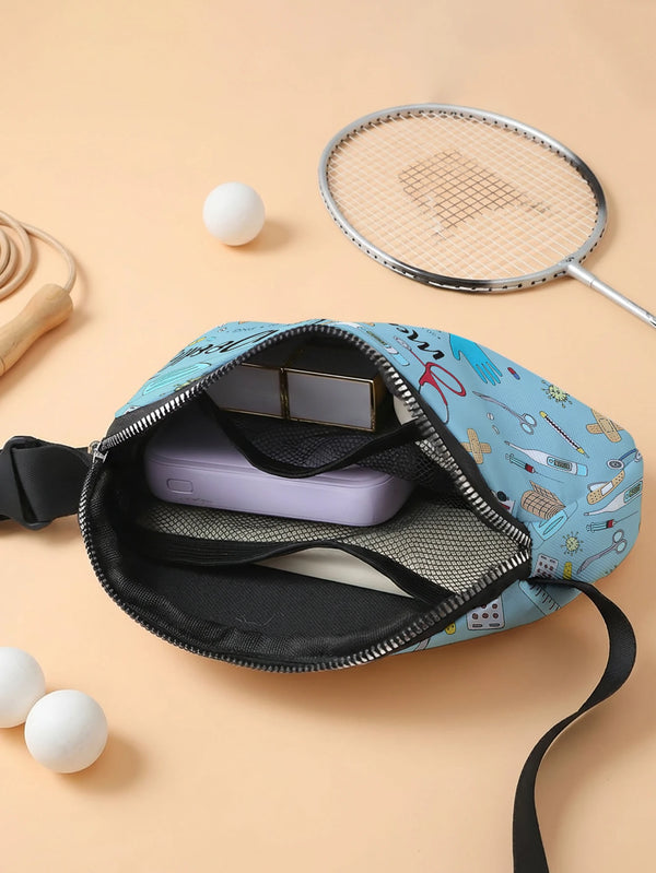 A blue and white doodle print crossbody waist bag with a zippered compartment and a silver-framed mirror, resting on a light 