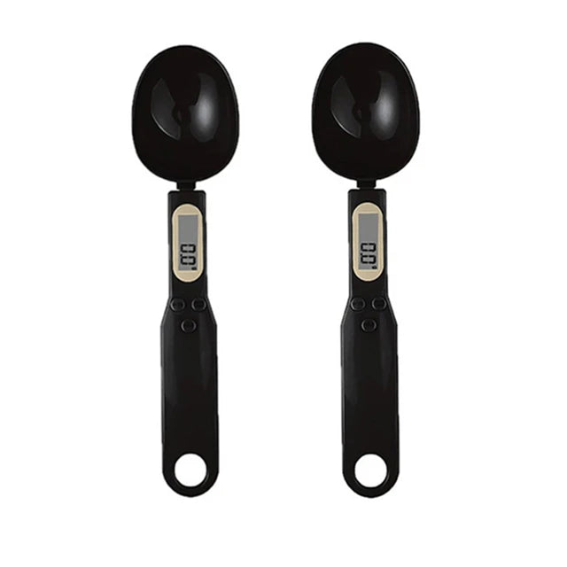 A pair of black precision digital kitchen scales with measurement displays.