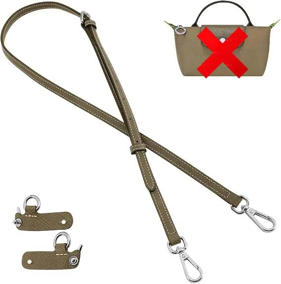 A brown leather crossbody strap with a decorative red cross buckle and attached leather loops.