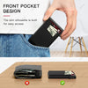 A hand places a black metal RFID blocking card holder into the front pocket of a denim shirt.