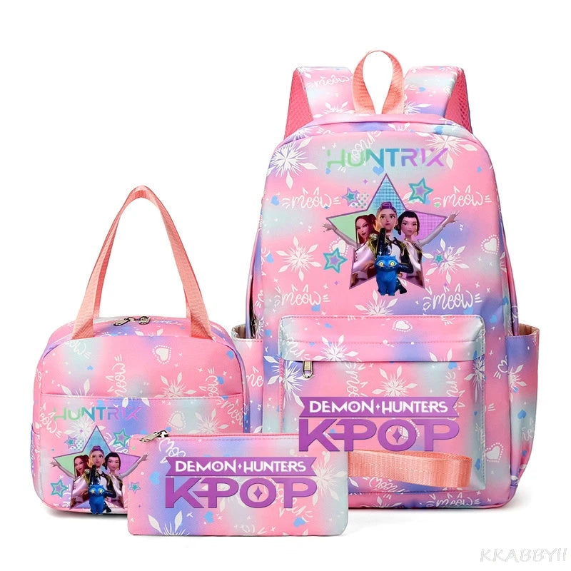 A pink multi-compartment backpack set featuring a Pokemon theme with Demon Hunters and Kpop graphics.